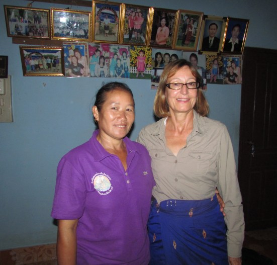Song Ting and Sarah in front of the family photo montage