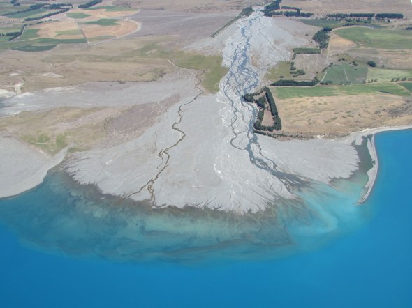 A geographers paradise a glacial stream, complete with debris reaches the lake